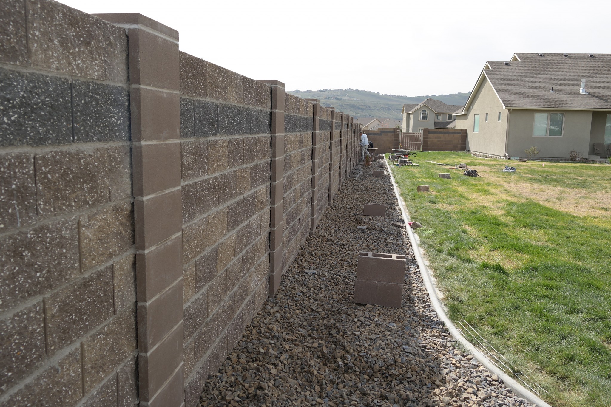 Split-face concrete block wall with pilasters