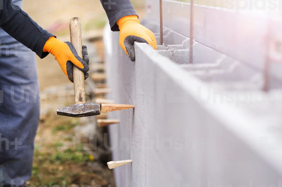 Segmental block retaining wall in a landscaped yard